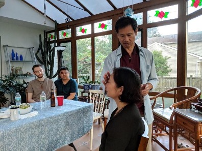 Cheung using qigong to heal a family friend in New Jersey.